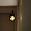 Photo of Harry Potter night light hanging on a wall near a door