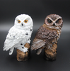 side by side photo of white and brown versions of solar owl garden light