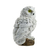 side and back view of white owl solar light that can be placed in a garden