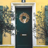 Load image into Gallery viewer, small wheat wreath on a door